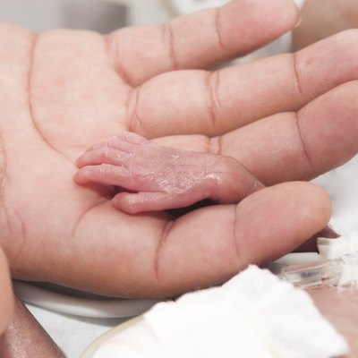 Newborn and hand