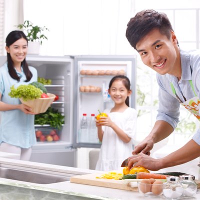 Family cooking in kitchen