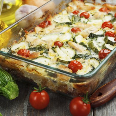 Zucchini baked i with chicken, cherry tomatoes and herbs