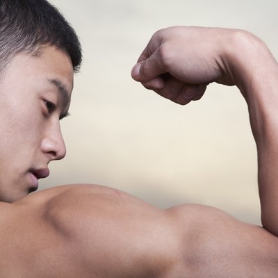Young Man showing off his bicep muscles