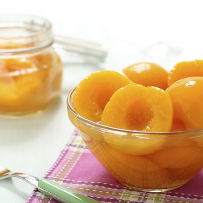 ​​peach syrup in glass jar