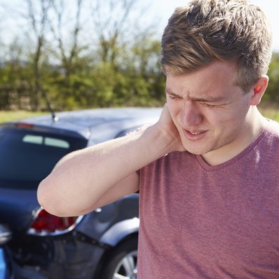 Driver Suffering From Whiplash After Traffic Collision