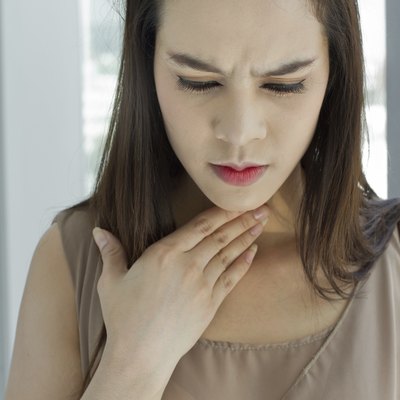 sick woman with throat problem