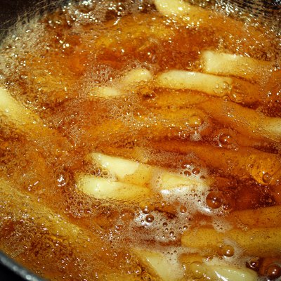 French fries cooking in deep fryer