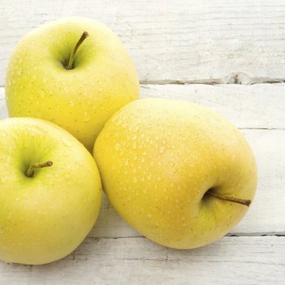 three golden delicious apples