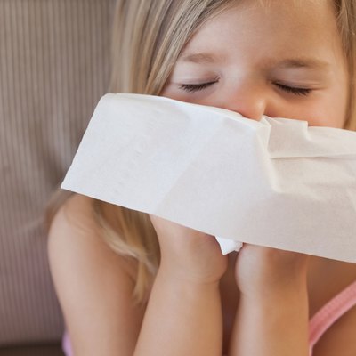 Cute little girl suffering from cold