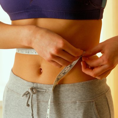 Woman measuring herself