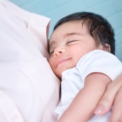 Cute baby on mothers hands