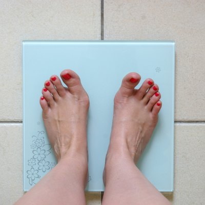 Woman weighing herself