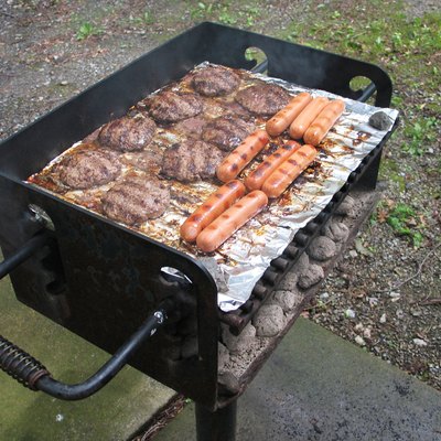 Meat cooking on charcoal grill