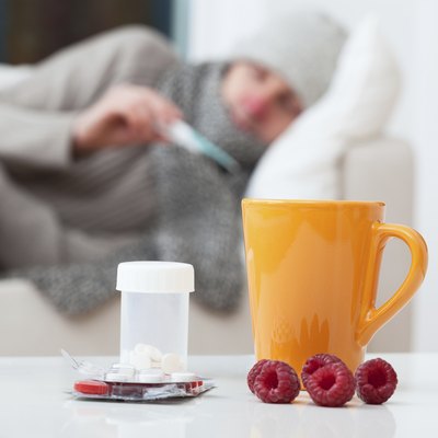 Man in bed having a cold
