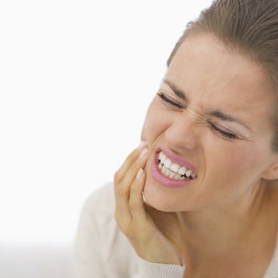 portrait of young woman with toothache