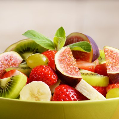 Healthy fruit mix salad on the kitchen table