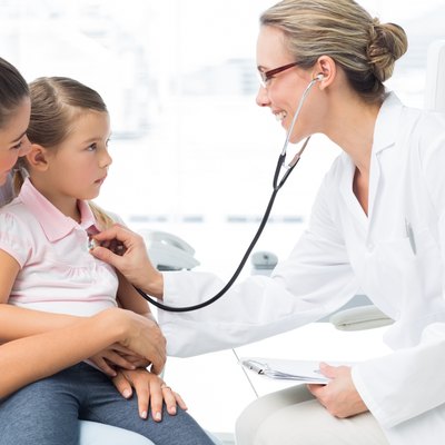 Girl being examined by female doctor