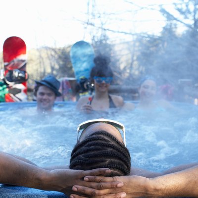 Young people relaxing in hot tub