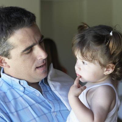 Close-up of a father face to face with his daughter