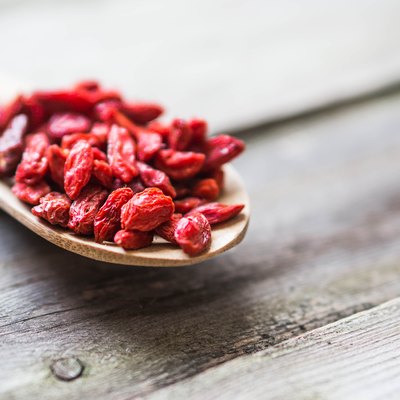 Goji berries on wooden background