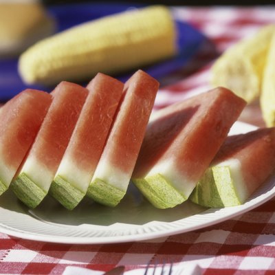 Close-up of watermelon slices on a plate on a picnic table