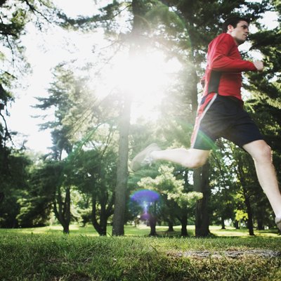 Man running through forest