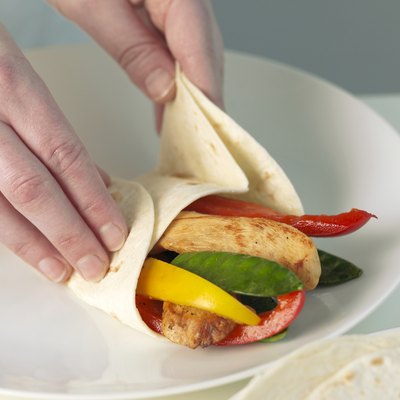 Wrapping tortilla around filling, close up
