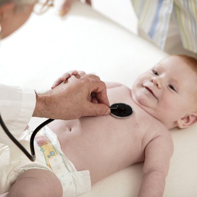 Doctor examining baby