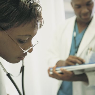 Physician using stethoscope