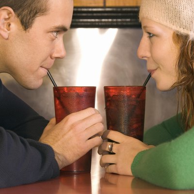 Couple drinking sodas