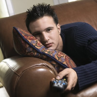 Man lounging with a remote control