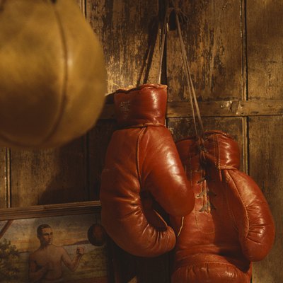 Boxing gloves hanging from wall