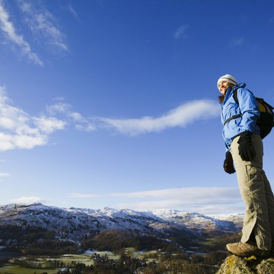 Woman standing on mountaintop