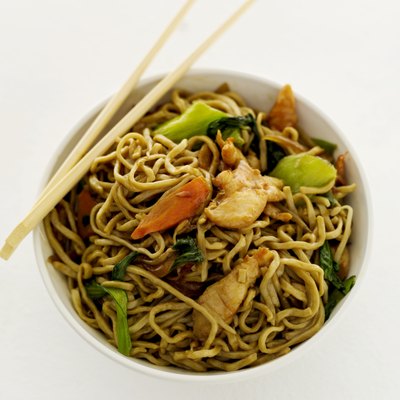 high angle view of chinese noodles in a bowl and a pair of chopsticks