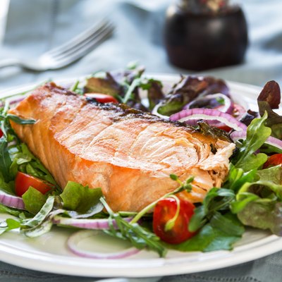 Salmon steak with salad