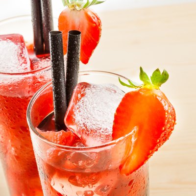 detail of two glasses of strawberry cocktail with ice