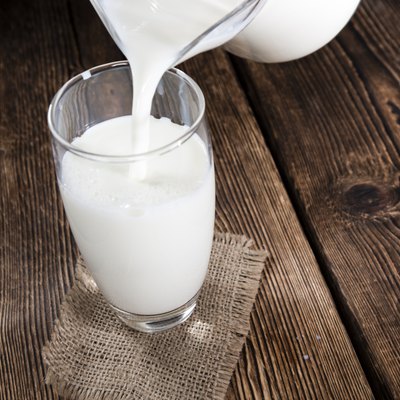 Milk on a dark wooden background