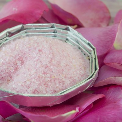 Pink aromatic bath in a bowl salt decorated with roses