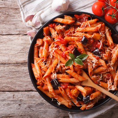 Italian Pasta alla Norma close-up and ingredients. horizontal to