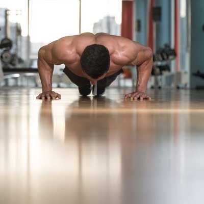 Young Adult Athlete Doing Push Ups As Part Of Bodybuilding Training