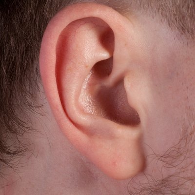 Men's ear. Close up.