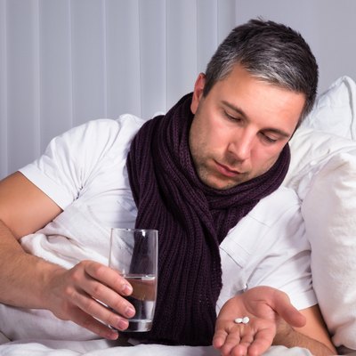 Man Looking At Pills