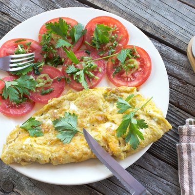 Omelette fried eggs with vegetables