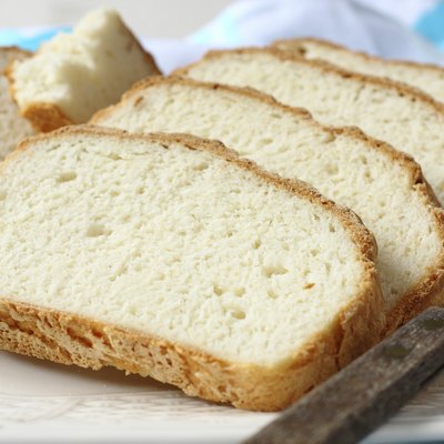 Fresh from the oven sliced gluten free bread on plate