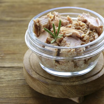 canned tuna with rosemary in a glass jar