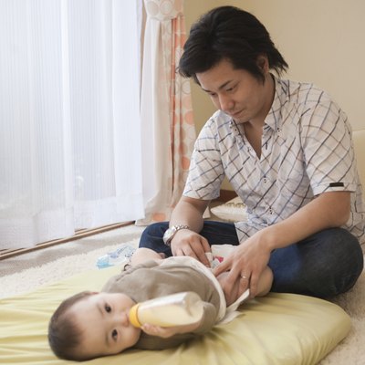 Father Diapering Baby Girl