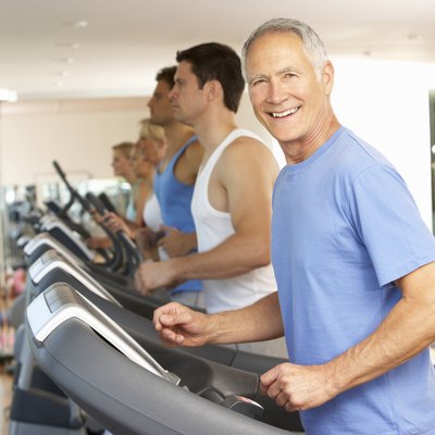 Senior Man On Running Machine In Gym