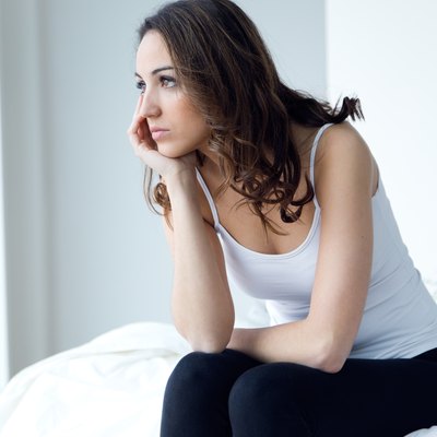 Young woman suffering from insomnia in the bed.
