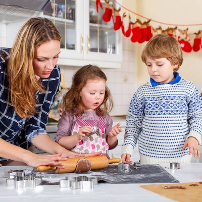Happy family baking Christmas cookies at home