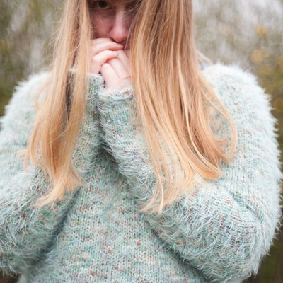 Blonde woman wearing fluffy jumper