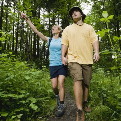Couple walking through forest