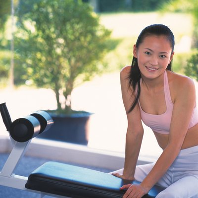Image of a Young Adult Woman About to do Some Exercises, Looking at Camera, Smiling, Differential Focus