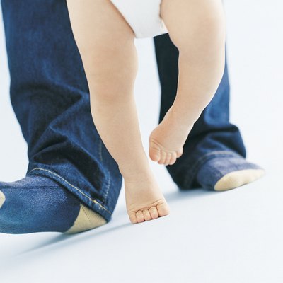 Parent Helping Their Baby to Walk